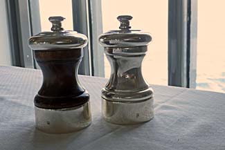 Salt and pepper grinders on L'Austral