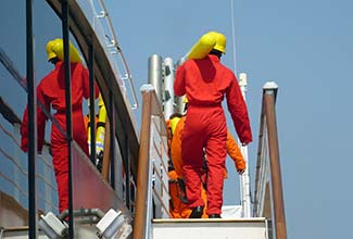 Men in orange jumpsuits