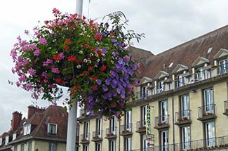 Flowers on lamppost in Caudebec-en-Caux