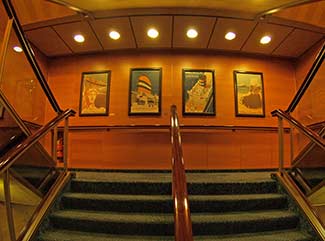 MS ROTTERDAM staircase with cruise posters