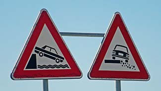 Warning signs on Alghero waterfront