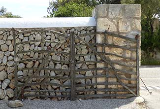 Stone with olive-wood gate on Menorca
