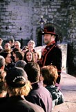 Tourists and Beefeater at Tower of London