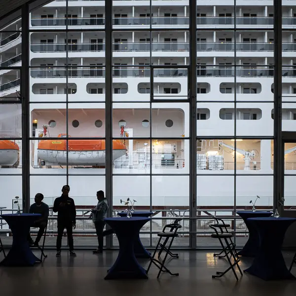 Passengers await boarding at the Rotterdam cruise terminal.