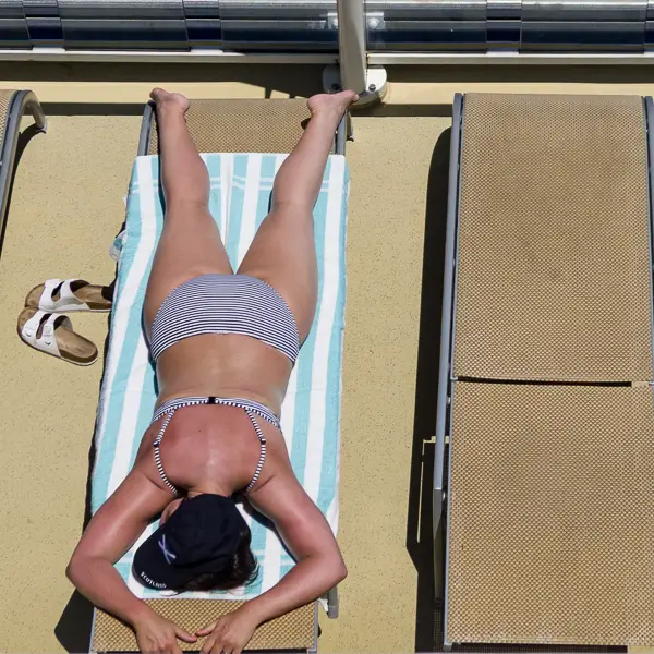 A passenger sunbathes on a Norwegian Cruise Line ship in the Mediterranean.