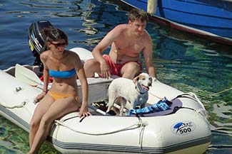 Couple with boat and dog in Hvar