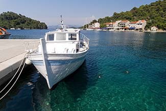 Pomena waterfront with vintage boat