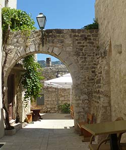 Street with archway in Rab's old city