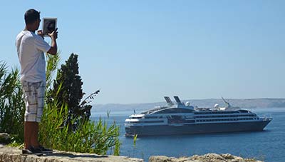 Tourist with iPad in Rab, Croatia