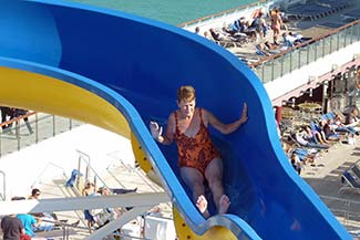 Lady on Costa Magica water slide
