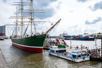 Sailing ship and sightseeing boats at St. Pauli Piers, Hamburg