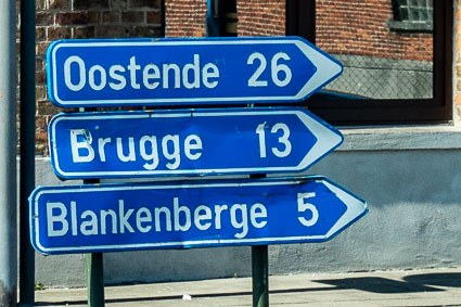 Signpost with distances to Ostend, Bruges, and Blankenberge from Zeebrugge, Belgium