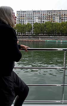 Cheryl Imboden on French balcony of RIVER BARONESS