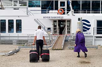 RIVER BARONESS captain with luggage at embarkation