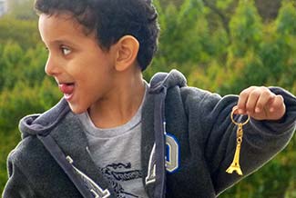 Boy with Eiffel Tower keyring