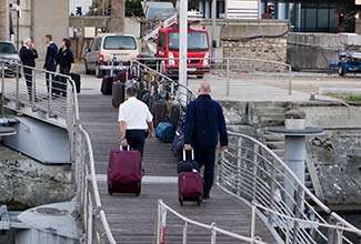 RIVER BARONESS officers taking luggage ashore