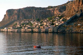 Monemvassia fishing boat and old town photo