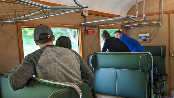 Passengers on Prague vintage railcar.