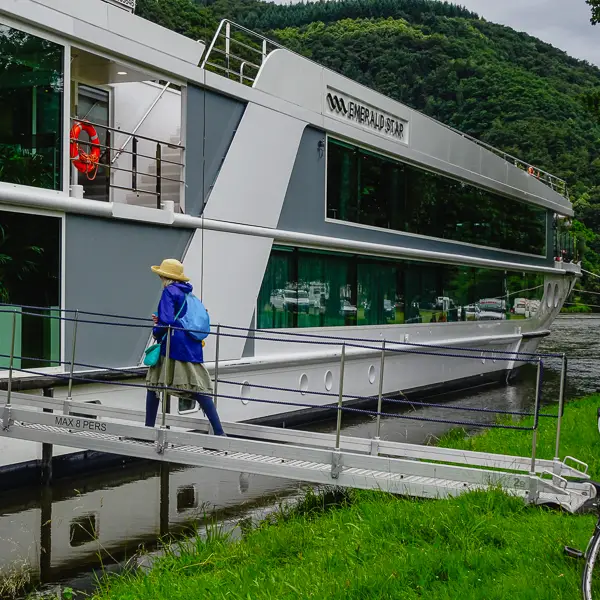 Cheryl Imboden boards a river vessel, EMERALD STAR, on the Moselle River in Bernkastel-Kues, Germany.
