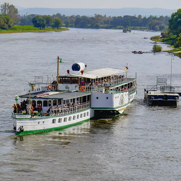 A vintage steamboat begins a sightseeing cruise on the Elbe River near Dresden.