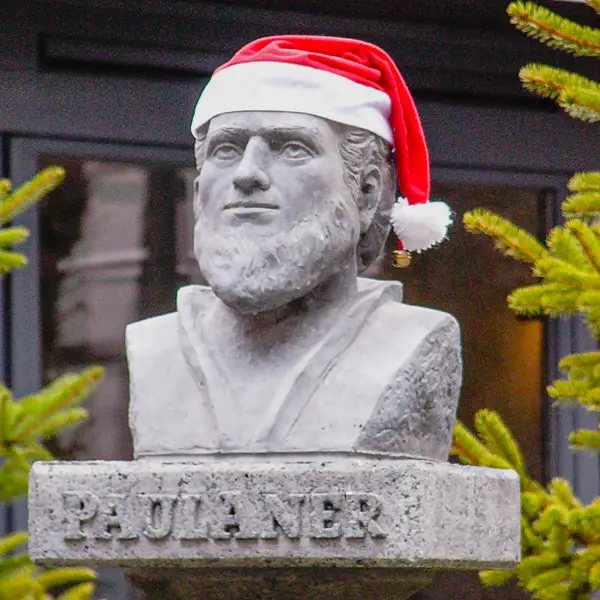 A statue sports a Santa hat in Erfurt, Germany.