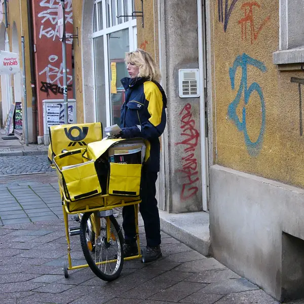 A postal carrier makes her rounds in Erfurt, Germany.