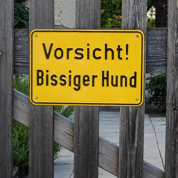 'Vorsicht! Bissiger Hund' is a politer way of saying 'Keep out.'