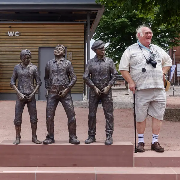 A tourist lines up with the locals at a public toilet in Miltenberg, Bavaria.