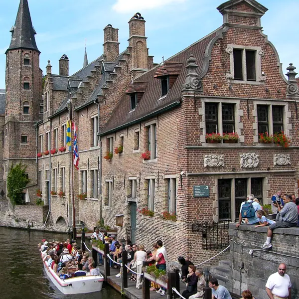 Passengers board a sightseeing boat in Bruges (a.k.a. Brugge), Belgium.