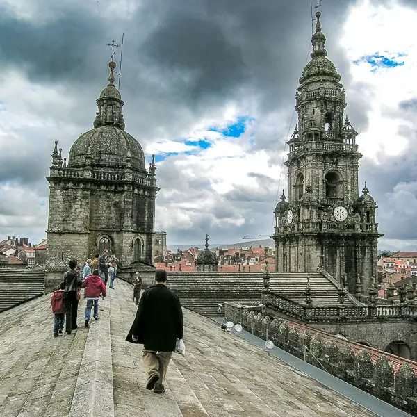 Tourists and pilgrims tour the roof of the cathedral in Santiago de Compostela, Spain.