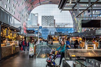 Mother with stroller in Markthal, Rotterdam
