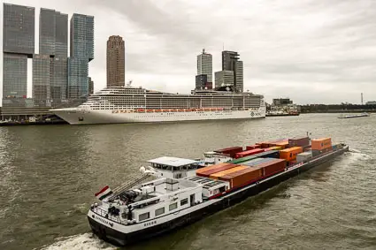 Rotterdam Cruise Terminal and a container barge
