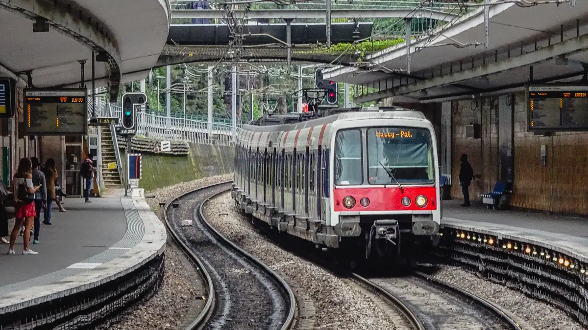 A Paris RER Line B train enters the Cit Universitaire station.