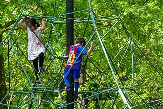 Children climbing in Luxembourg Gardens playground
