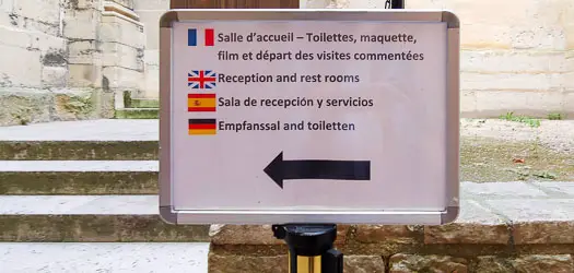 Sign for reception and public toilets in Saint-Denis Basilica Cathedral