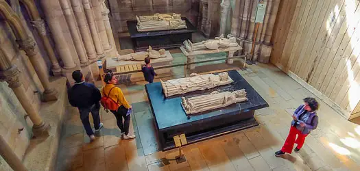 Visitors with recumbent statues in Basilique Cathédrale de Saint-Denis