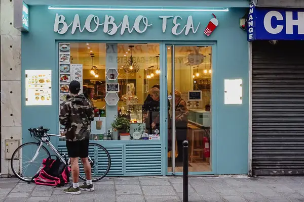 Bicyclist at BaoBao Tea shop in Paris.