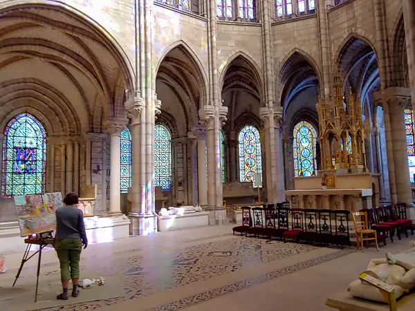 An artist works at an easel in the Saint-Denis Basilica Cathedral, where nearly all of France's kings are interred.