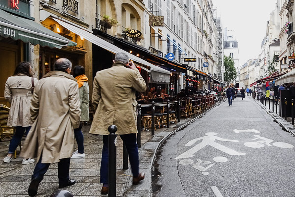 Beige coats in the Rue de Buci, Paris.