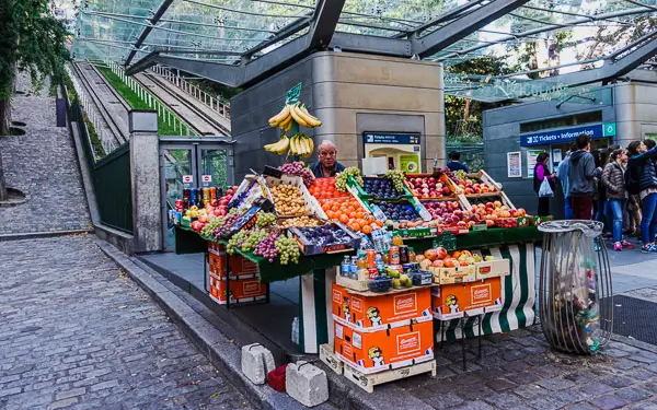 Montmarte Funicular and fruit vendor in Paris.