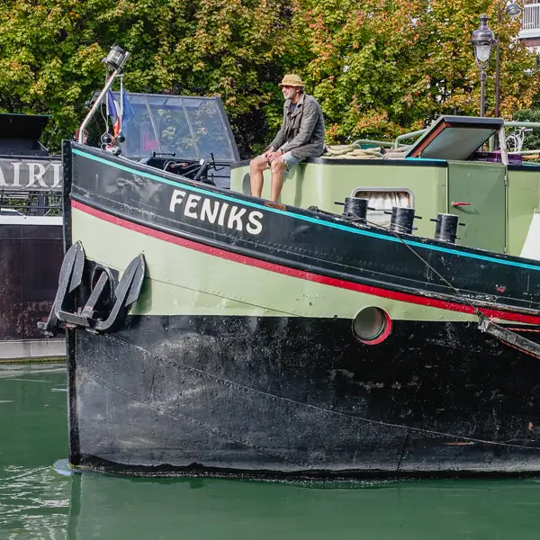 A barge cruises on the Canal de l'Ourcq near the northern edge of PAris.