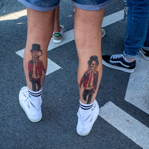 A man with canine tattoos waits for an airport bus in Beauvais, France.