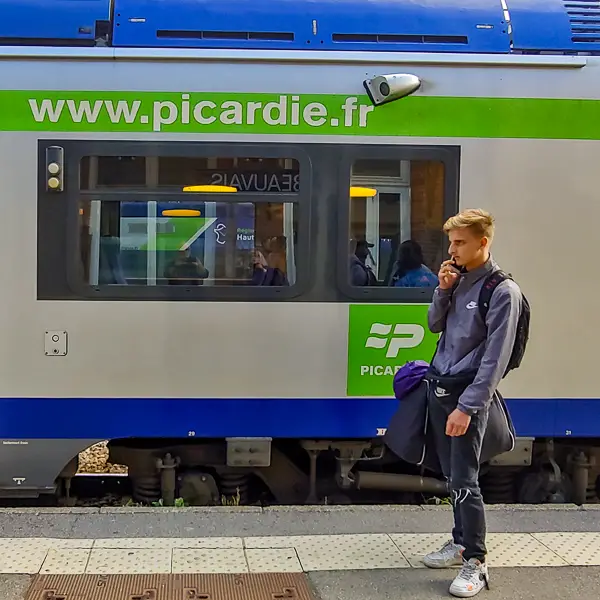 A young man prepares to board a train for Beauvais, the delightful capital of Picardy and Ryanair's airport for Paris.