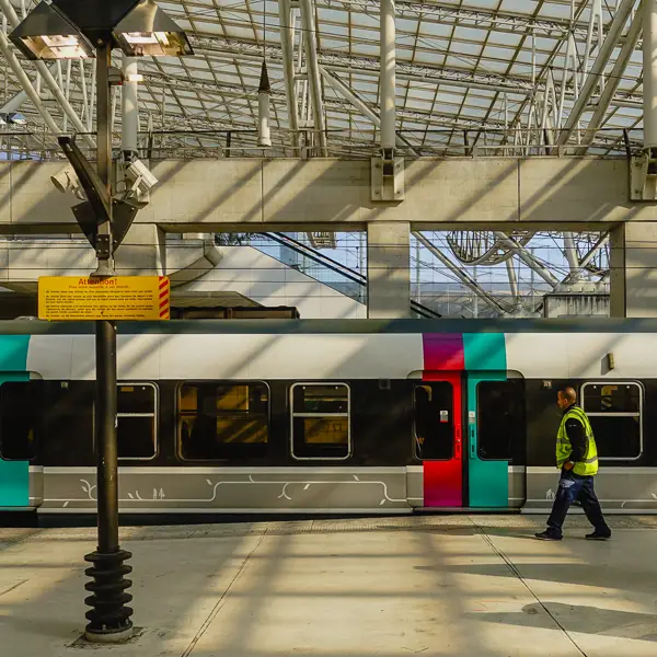 An RER train arrives at Paris Charles de Gaulle Airport.