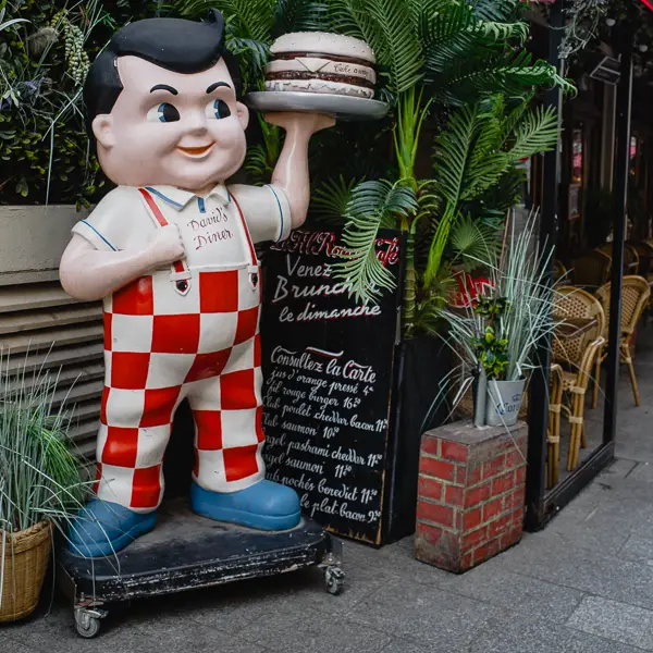 Le Fil Rouge Café displays a repurposed David's Diner sculpture in Paris.