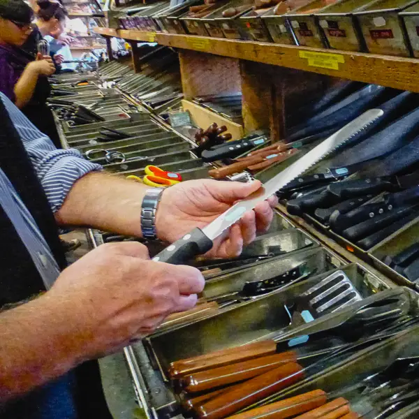 Durant Imboden checks out bread knives at E. Dehillerin, the premier purveyor of kitchenware in Paris.