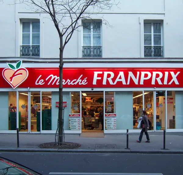 A man walks past a supermarket in Montmartre.