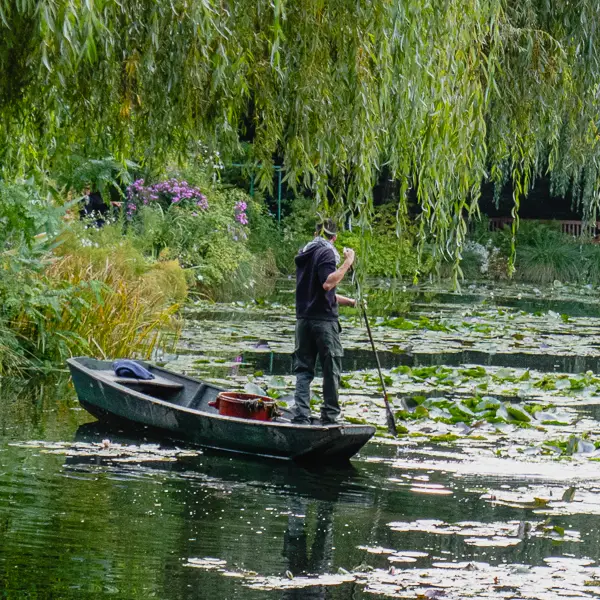 A gardener tends the pond at Claude Money's Giverny, which is an easy train ride from Paris. This year, the house and gardens are open through November 1.