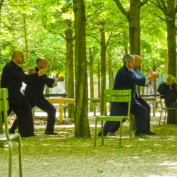  Parkgoers practice Tai Chi in the Jardin du Luxembourg.