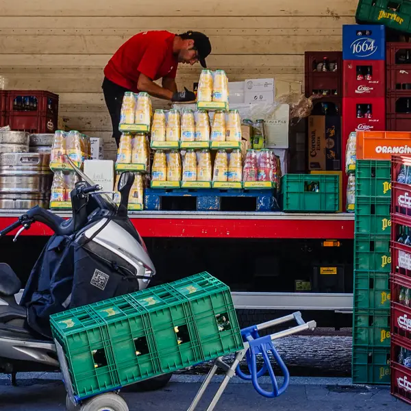 A truck driver brings drinks to a café in Montmartre.
